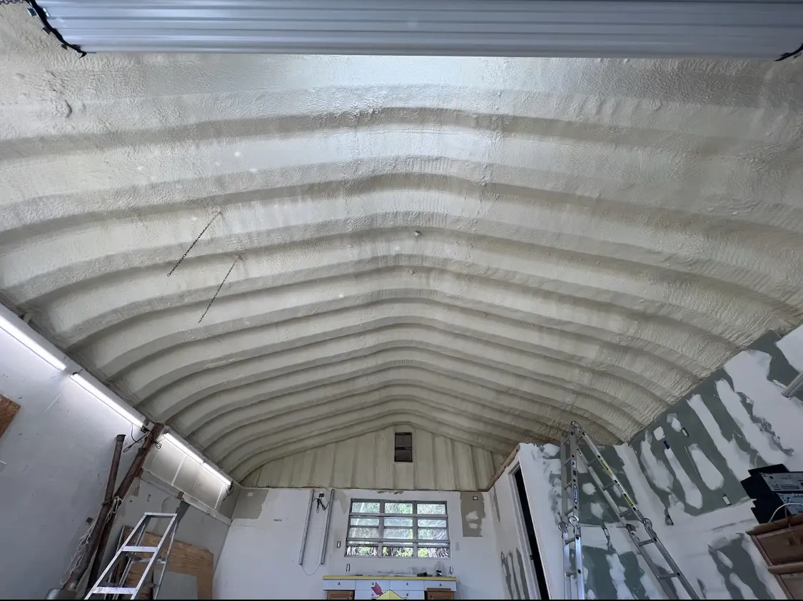 Spray polyurethane foam applied to the underside of a metal roof deck in Cheltenham